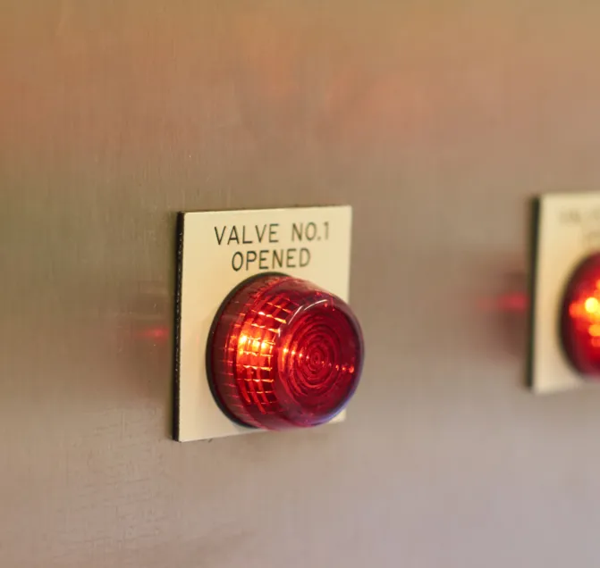 An indicator lamp lit on a control panel beside a label reading Valve No. 1 Opened